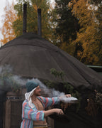 Traditional Finnish sauna ritual in a yurt sauna